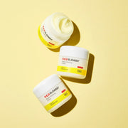 ProtoClinical k-beauty olive beauty product silhouette between pale yellow side panels on a light background.