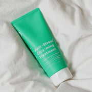 ProtoClinical k-beauty One-day's you Anti-Stress Cica:ming Treatment 200ml bright green treatment package angled diagonally on a pale pink and mint background.