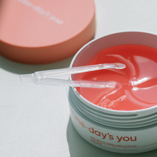 ProtoClinical k-beauty One-day's you Collagen Hydrogel Eye Patch 87g(60ea) single eye patch package with a dark mauve center band and aqua lower accent on a light background