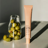 ProtoClinical k-beauty muted green and beige beauty product silhouette on a light background.