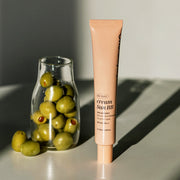 ProtoClinical k-beauty muted green and beige beauty product silhouette on a light background.