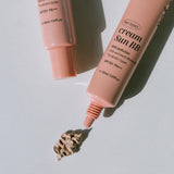 ProtoClinical k-beauty brown beauty bottle on a pale blue and white background.