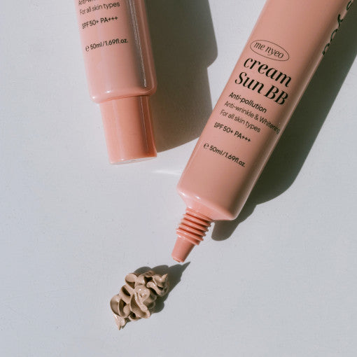 ProtoClinical k-beauty brown beauty bottle on a pale blue and white background.