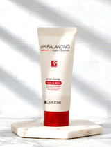ProtoClinical k-beauty skincare product packaging in warm neutral tones on a light background.
