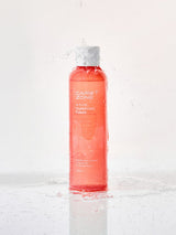 ProtoClinical k-beauty CAREZONE A-Cure Clarifying Toner 240ml single upright coral toner bottle centered on a pale blue background