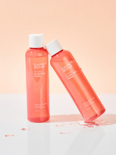 ProtoClinical k-beauty CAREZONE A-Cure Clarifying Toner 240ml single upright coral toner bottle centered on a pale blue background