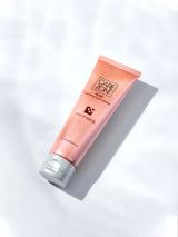 CAREZONE Acne Clarifying Foam Cleanser Duo Set (130ml+130ml) by ProtoClinical shown with a single warm-toned cleanser tube on a pale blue background for a k-beauty skincare routine.