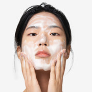 ProtoClinical k-beauty soft beige beauty graphic with a muted pink center on a light gray background.