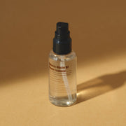 ProtoClinical k-beauty warm brown beauty detail with a darker horizontal center and golden lower tones on a light background.
