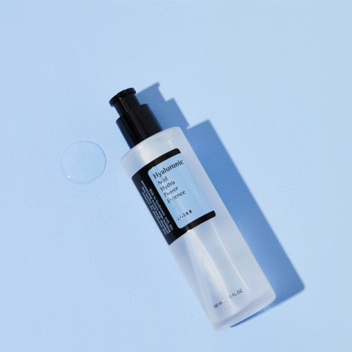 ProtoClinical k-beauty COSRX Hyaluronic Acid Hydra Power Essence 100ml single centered essence bottle with pale blue packaging on a soft blue background