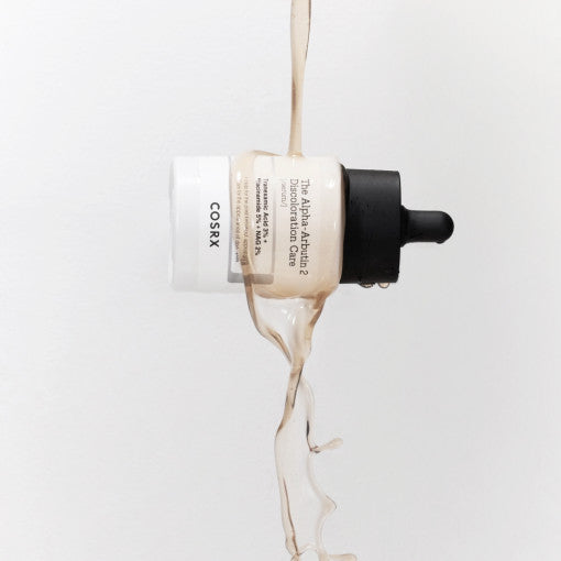 ProtoClinical k-beauty COSRX The Alpha-Arbutin 2 Discoloration Care Serum 50ml single centered serum bottle on a white background with a dark cap