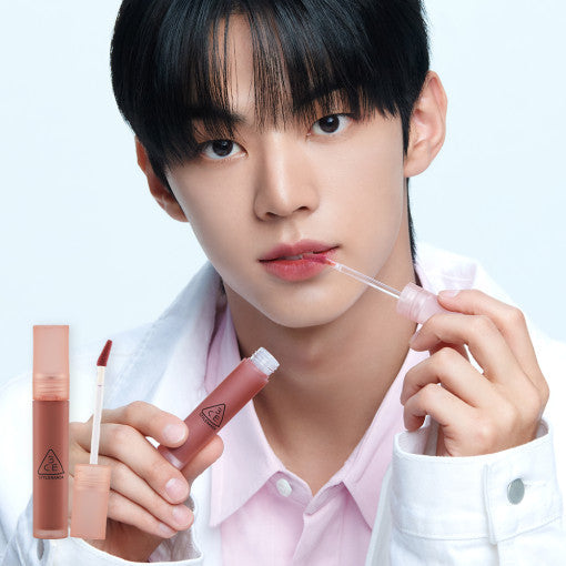 ProtoClinical k-beauty 3CE Blur Water Tint 4.6g single upright rose lip tint tube centered on a pale background with soft blue side bands