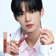 ProtoClinical k-beauty 3CE Blur Water Tint 4.6g single upright rose lip tint tube centered on a pale background with soft blue side bands
