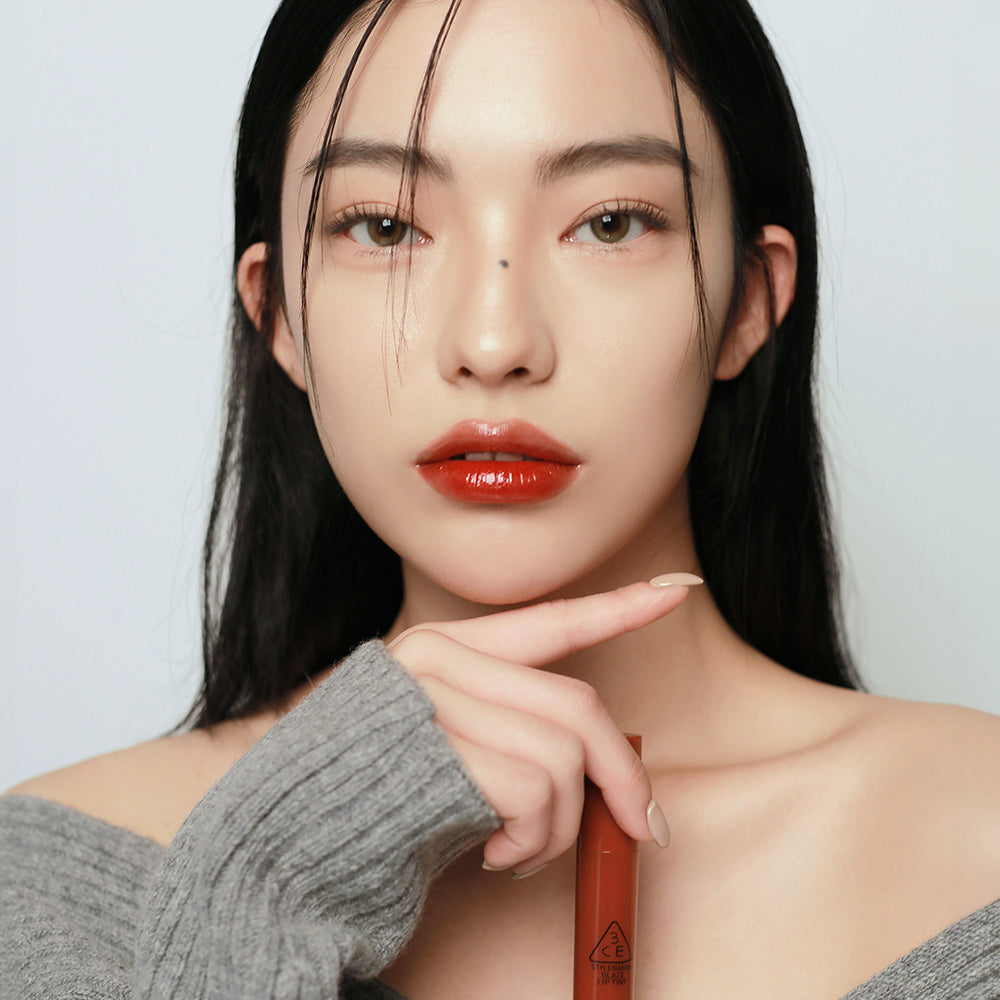 ProtoClinical k-beauty 3CE GLAZE LIP TINT 5g single lip tint package centered in a product packshot on a clean white background
