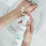 ProtoClinical k-beauty make p:rem Safe Me. Relief Moisture Cleansing Milk 500ml beige product packaging with a soft vertical silhouette on a light background