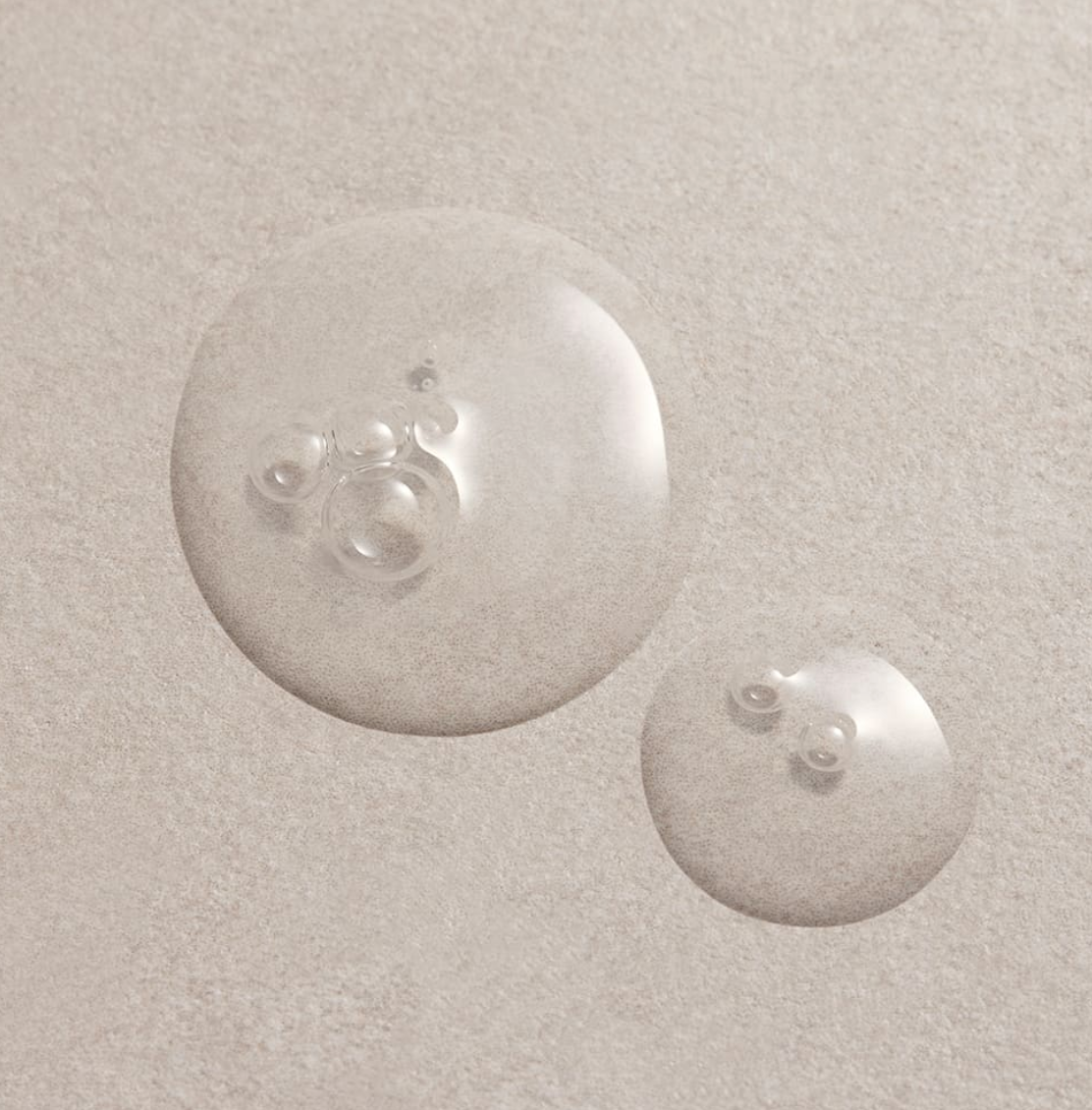 ProtoClinical k-beauty pale taupe beauty graphic on a light background.