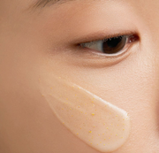 ProtoClinical k-beauty warm tan beauty detail image with soft brown shading on a light background.