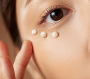 ProtoClinical k-beauty warm peach beauty detail image with deep brown side shading on a light background.