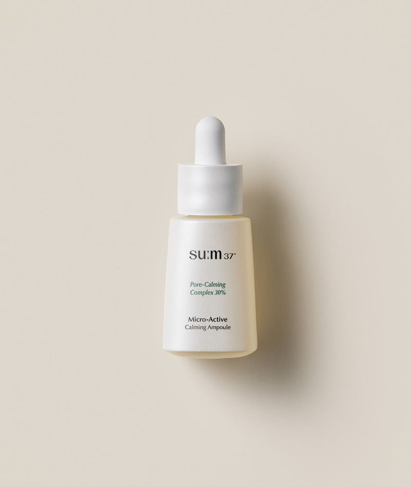ProtoClinical k-beauty su:m37 Micro-Active Calming Ampoule 15ml ampoule bottle on a light neutral background.