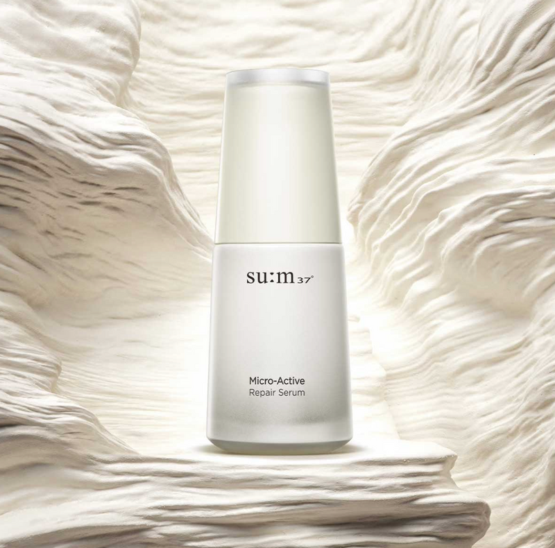 ProtoClinical k-beauty beauty product packaging on a soft light background.