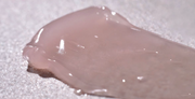 ProtoClinical k-beauty mauve and pale blue beauty product detail image.