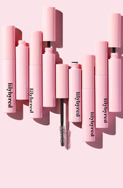 ProtoClinical k-beauty lilybyred Am9 to Pm9 Survival Colorcara single tall pink mascara package centered vertically on a pale pink background with a darker mauve center