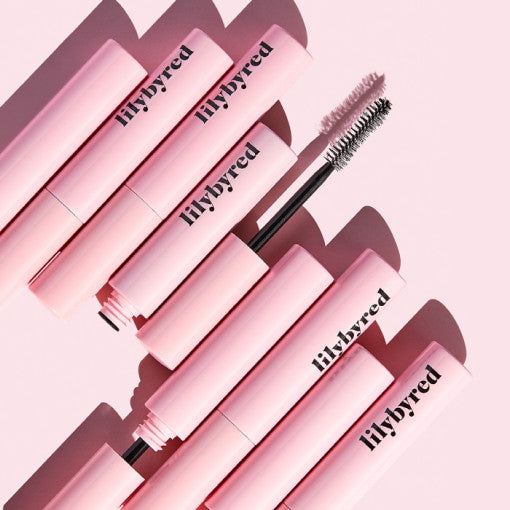 ProtoClinical k-beauty lilybyred Am9 to Pm9 Survival Colorcara single pink mascara package centered vertically on a pale pink background with soft mauve side shading
