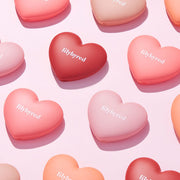 ProtoClinical k-beauty lilybyred LUV BEAM CHEEK 4.7g single square packshot centered on a rose-pink background.