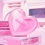 ProtoClinical k-beauty cosmetic packaging graphic in soft pink and lilac tones on a light background.