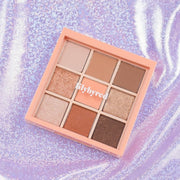 ProtoClinical k-beauty cosmetic packaging in coral tones on a soft blue background.