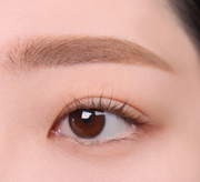 ProtoClinical k-beauty lilybyred Skinny Mes Brow Mascara 3.5g two horizontal brow swatches in light taupe and deep brown on a pale pink background