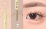 ProtoClinical k-beauty lilybyred Smiley Aegyosal Eyeliner 0.32g wide peach-beige swatch beside a rosy-brown stripe on a pale cream background