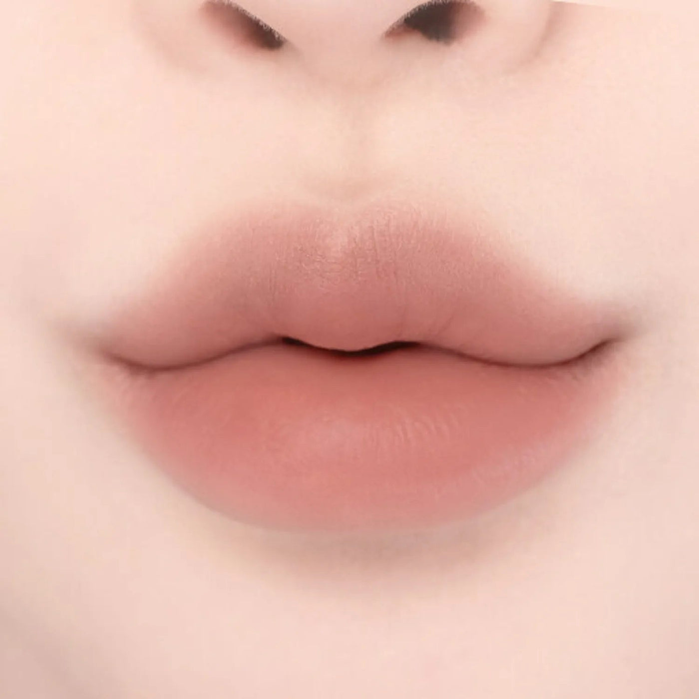 ProtoClinical k-beauty lilybyred Smiley Lip Blending Stick 0.8g single lip swatch in a wide horizontal band on a pale cream background
