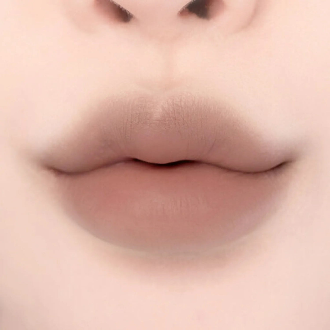 ProtoClinical k-beauty lilybyred Smiley Lip Blending Stick 0.8g single lip swatch in a wide horizontal band on a pale cream background