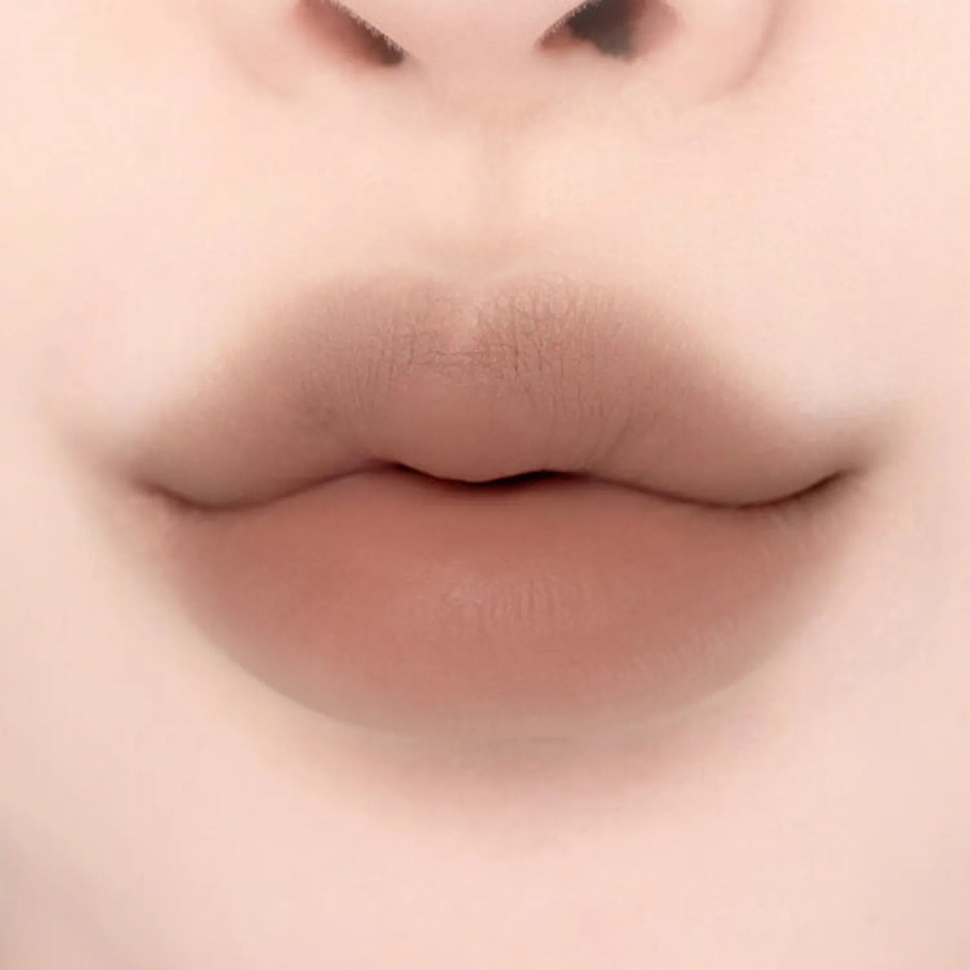 ProtoClinical k-beauty lilybyred Smiley Lip Blending Stick 0.8g single lip swatch in a wide horizontal band on a pale cream background