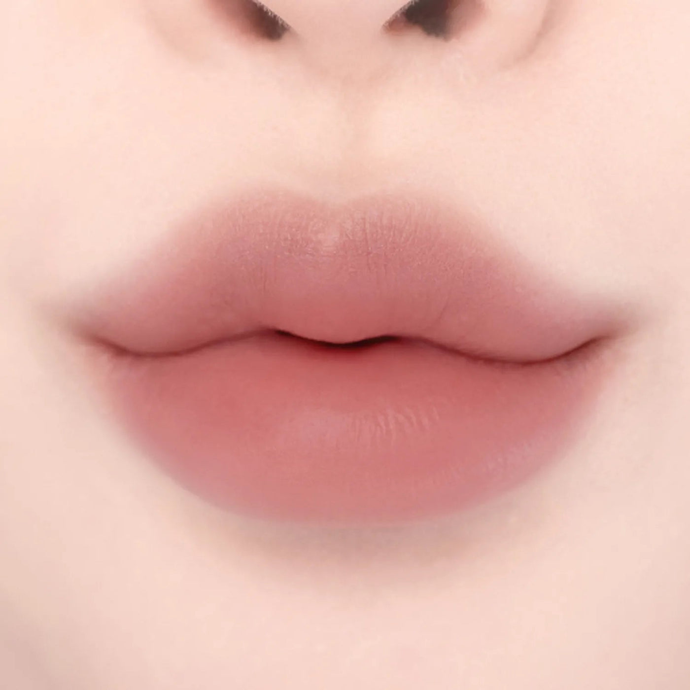 ProtoClinical k-beauty lilybyred Smiley Lip Blending Stick 0.8g single lip swatch in a wide horizontal band on a pale cream background
