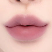 ProtoClinical k-beauty lilybyred Smiley Lip Blending Stick 0.8g deep rosy lip swatch in a wide horizontal band on a pale cream background