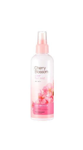 ProtoClinical k-beauty THE FACE SHOP Cherry Blossom Clear Hair Mist 200ml single pink mist bottle centered with pale floral side accents on a light background