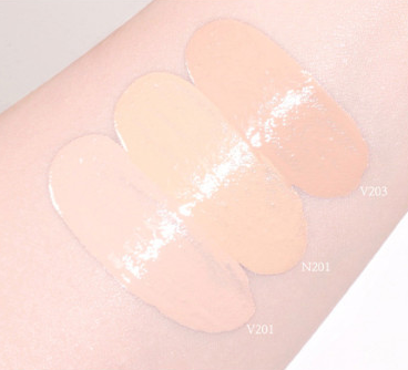 ProtoClinical k-beauty warm beige makeup swatch on a light background.