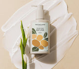 ProtoClinical k-beauty THE FACE SHOP The Botanic Woody Musk Body Lotion 350ml single upright pale beige lotion bottle centered on a white background with pale lavender side panels