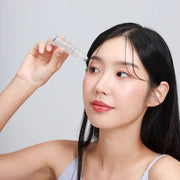 ProtoClinical k-beauty warm beige beauty detail with dark vertical bands on a light background.