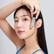 ProtoClinical k-beauty warm beige beauty detail with pale blue side tones on a light background.