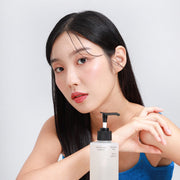 ProtoClinical k-beauty warm beige beauty detail with a dark brown center and pale blue accents on a light background.