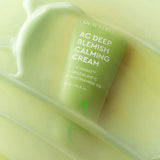 ProtoClinical k-beauty DEWYTREE AC Deep Blemish Calming Cream 60ml close-up of a lime green tube framed by glossy cream swirls on a soft yellow-green background