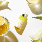 ProtoClinical k-beauty DEWYTREE Miracle Brightening Serum 30ml single upright olive-gray serum bottle centered on a pale background with warm yellow side accents