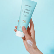 ProtoClinical k-beauty DEWYTREE Urban Shade Cool Calming Moist Sun 150ml single upright sunscreen bottle centered on a turquoise background with pale aqua side panels.