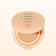 ProtoClinical k-beauty DEWYTREE Urban Shade Cover & Fit Sun Cushion SPF50+ PA++++ 14g single round sun cushion compact centered on a peach and pale aqua background.