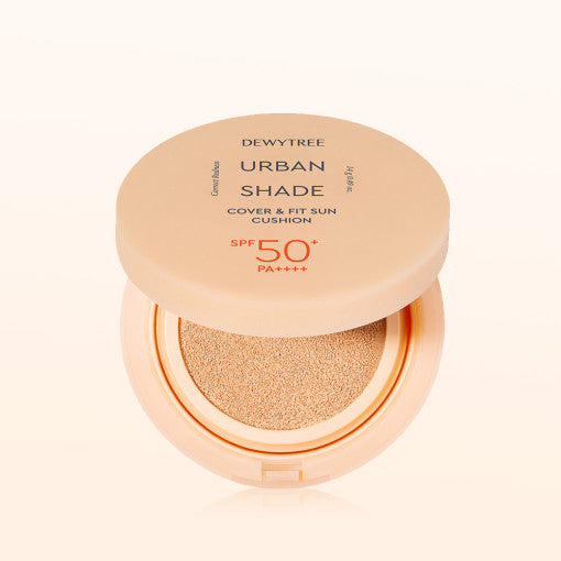 ProtoClinical k-beauty DEWYTREE Urban Shade Cover & Fit Sun Cushion SPF50+ PA++++ 14g single round sun cushion compact centered on a peach and pale aqua background.