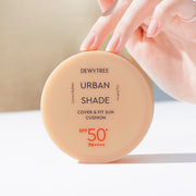 ProtoClinical k-beauty DEWYTREE Urban Shade Cover & Fit Sun Cushion SPF50+ PA++++ 14g single round sun cushion compact centered on a light background.