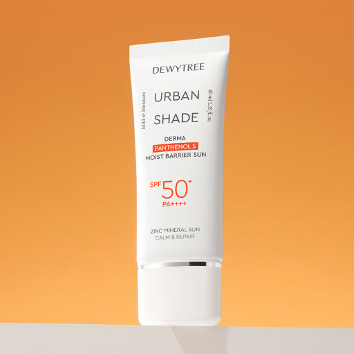 ProtoClinical k-beauty DEWYTREE Urban Shade Derma Panthenol 5 Moist Barrier Sun SPF50+ PA++++ 40ml single upright orange sunscreen tube centered on a warm orange and beige background.